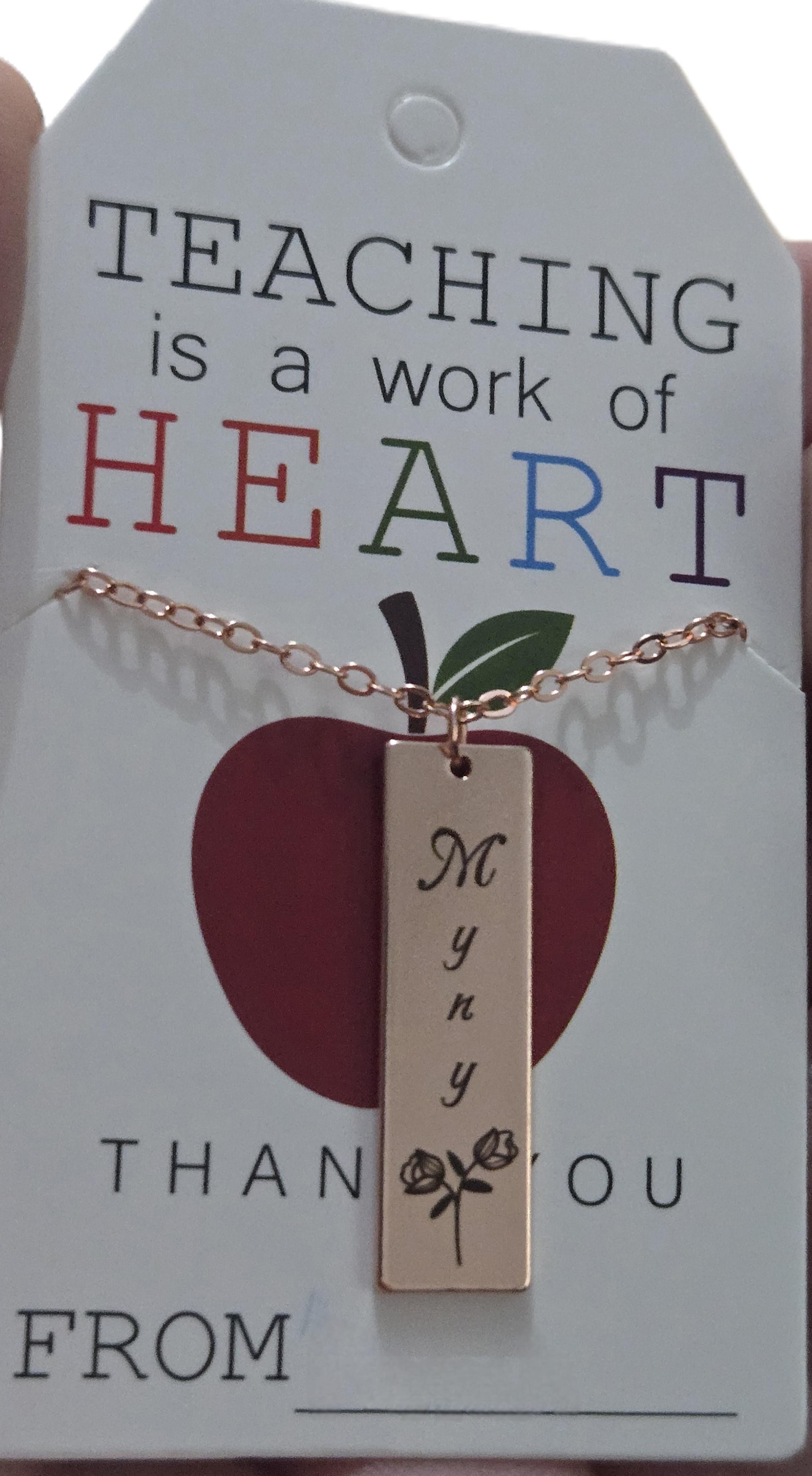 Custom engraved necklace presented on a teacher appreciation card