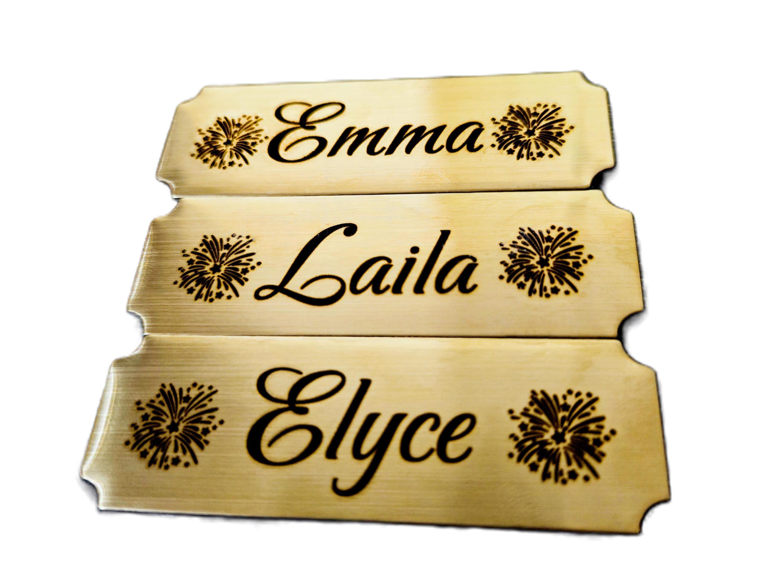 Gold engraved name plates with decorative flourishes